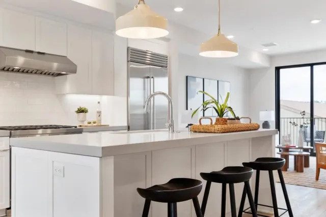 a kitchen with a table and chairs in it