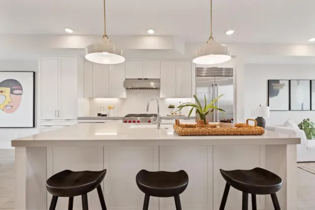 a view of a kitchen with a sink and wooden floor