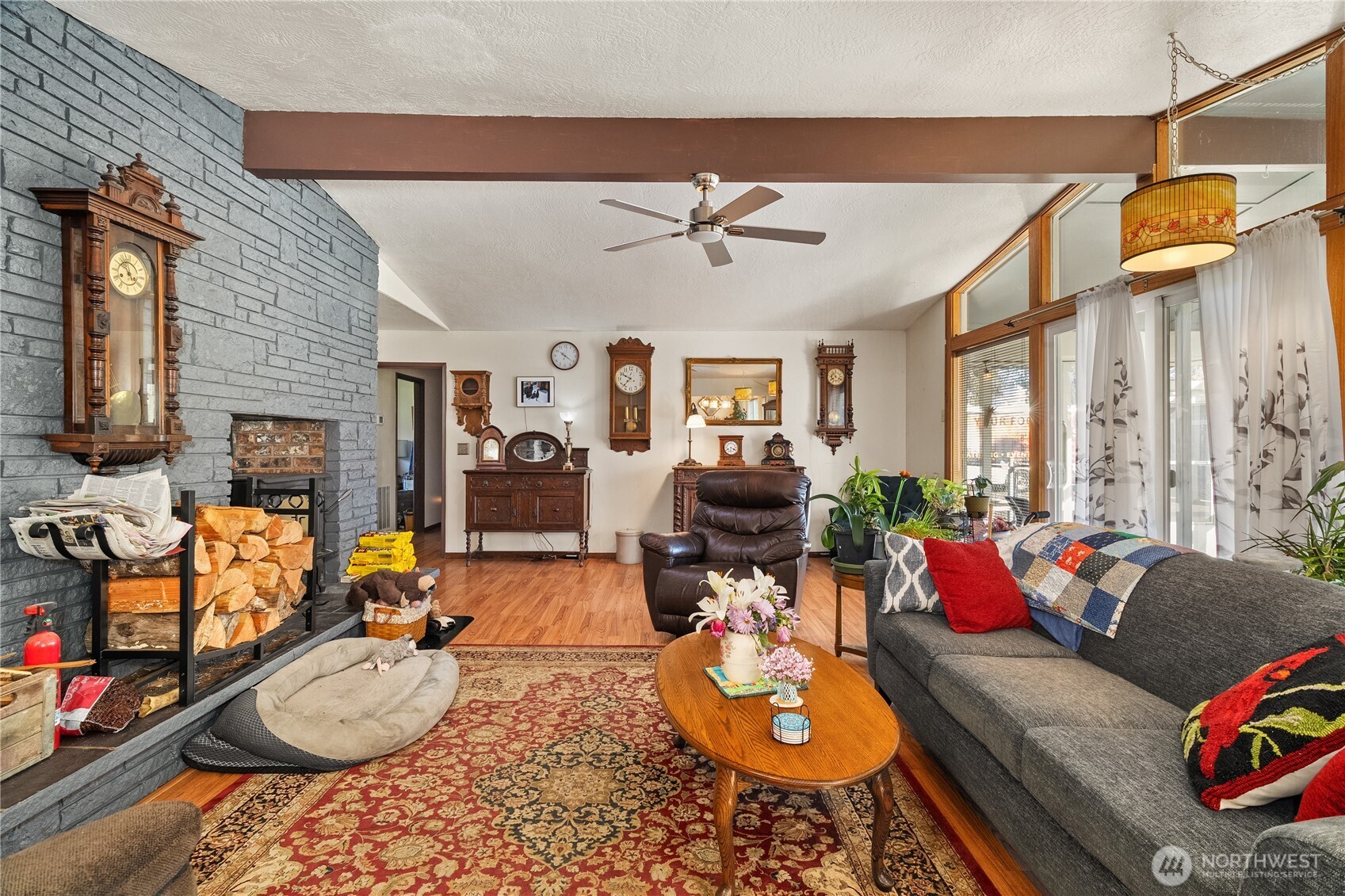 631 5th Avenue Forks, WA 98331 - Photo 13 of 40 a living room with furniture a fireplace and a flat screen tv