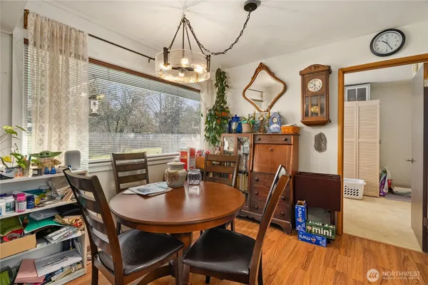 a view of a dining room with furniture window and wooden floor