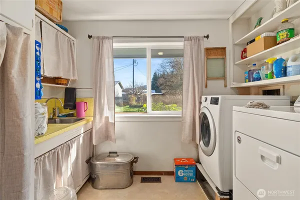 a utility room with dryer and washer