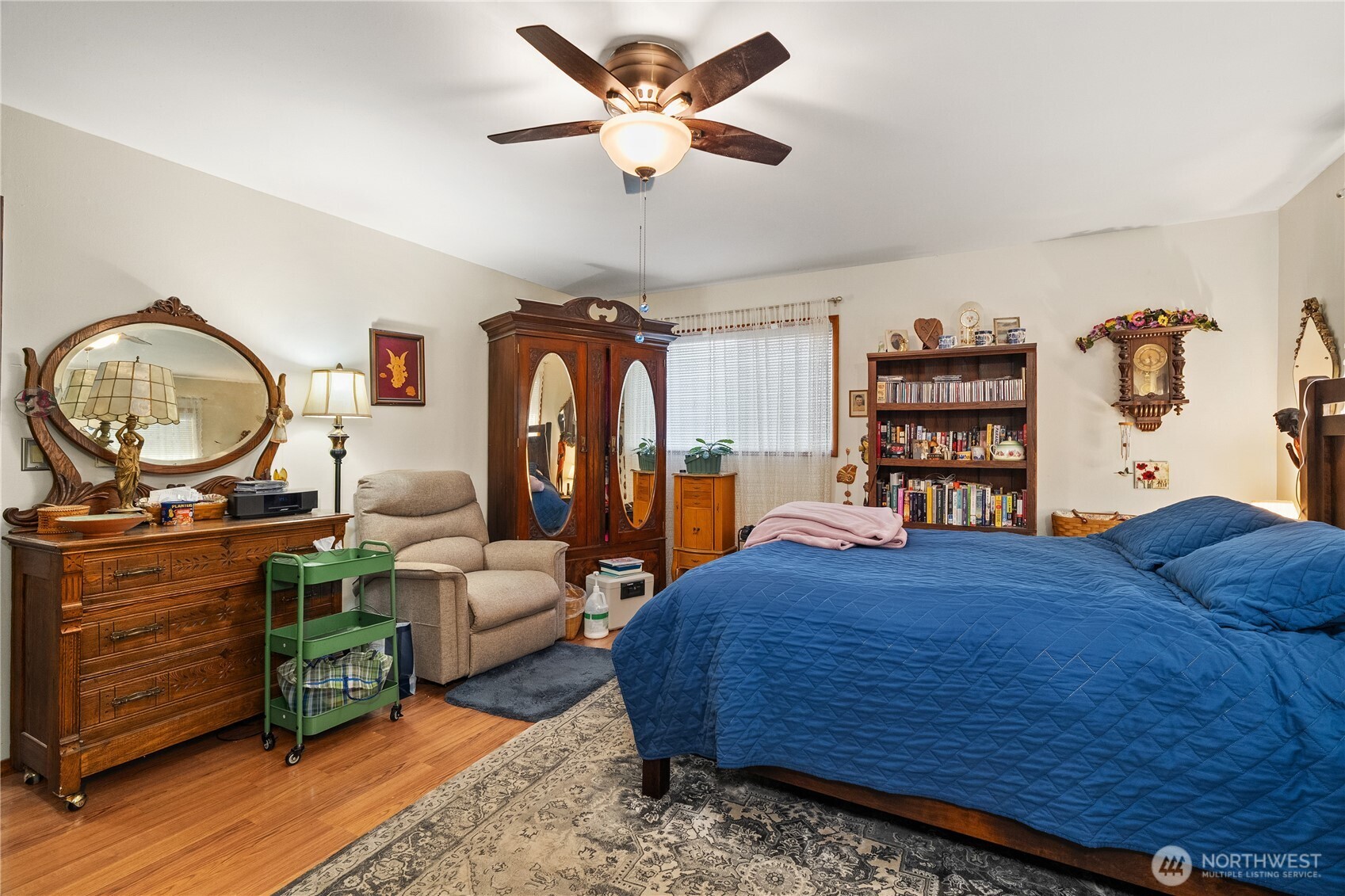 631 5th Avenue Forks, WA 98331 - Photo 18 of 40 a bedroom with a bed a dresser and book shelf
