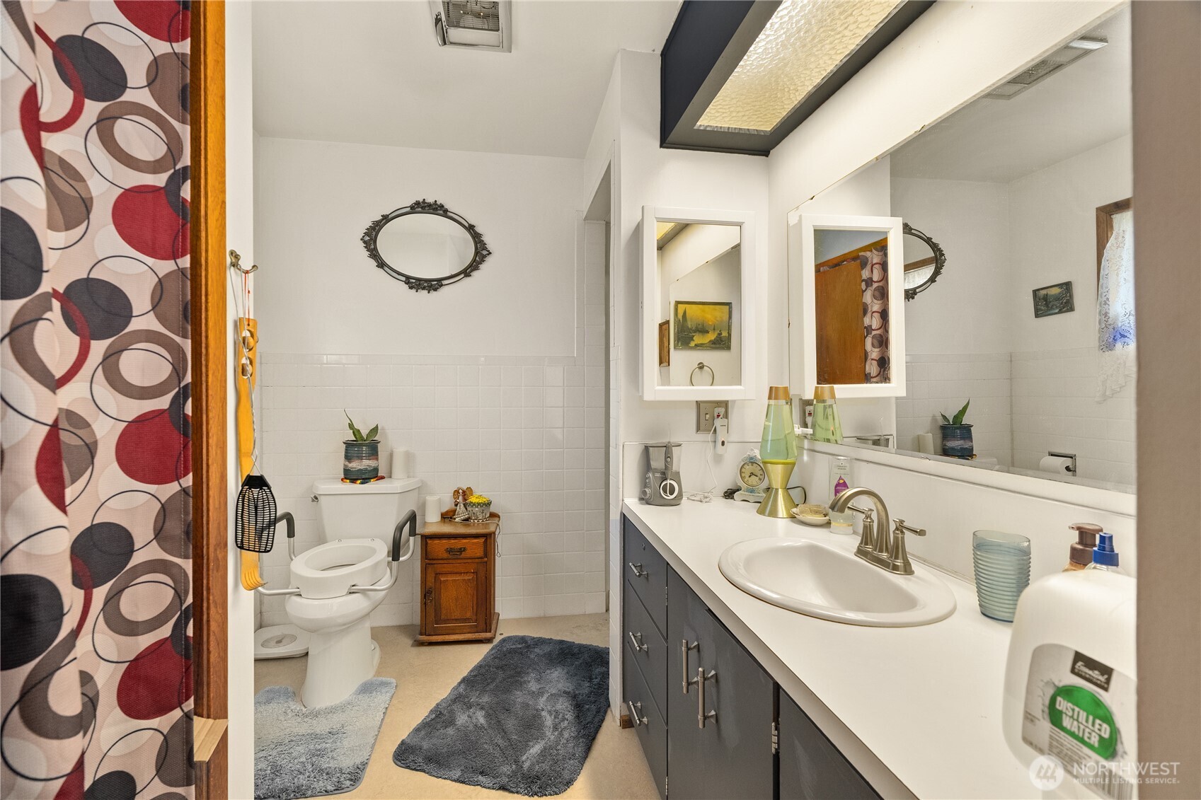 631 5th Avenue Forks, WA 98331 - Photo 19 of 40 a bathroom with a sink and a mirror