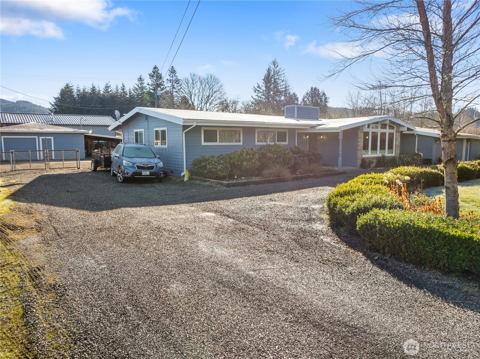 631 5th Avenue Forks, WA 98331 - Photo 2 of 40 a front view of a house with a yard and garage
