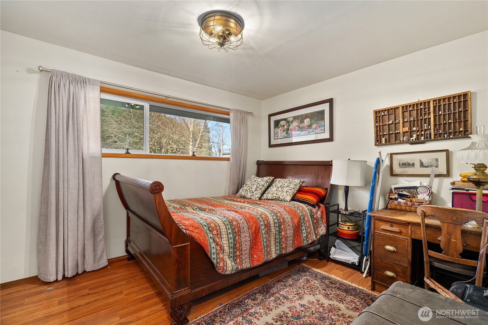 631 5th Avenue Forks, WA 98331 - Photo 23 of 40 a bedroom with a bed and wooden floor