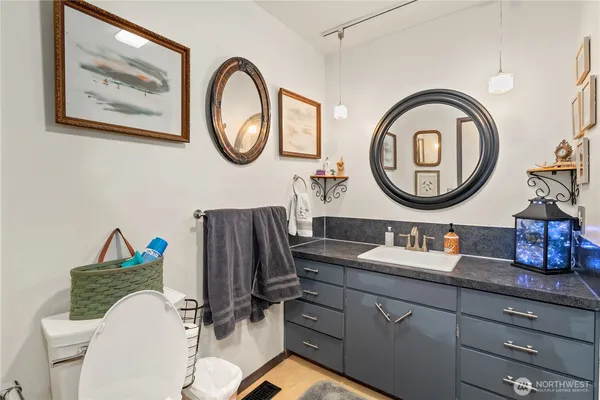 a bathroom with a toilet and a sink