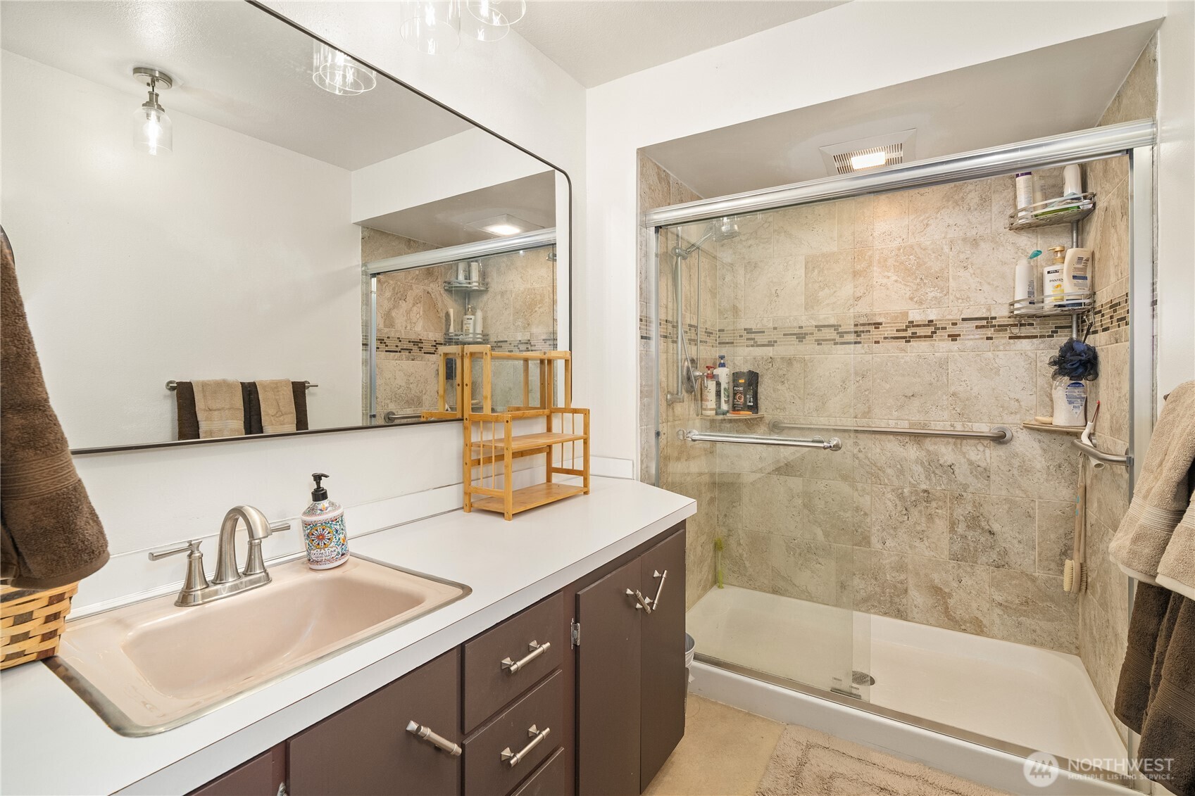 631 5th Avenue Forks, WA 98331 - Photo 29 of 40 a bathroom with a sink and a mirror