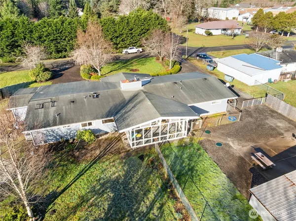 an aerial view of residential houses with outdoor space