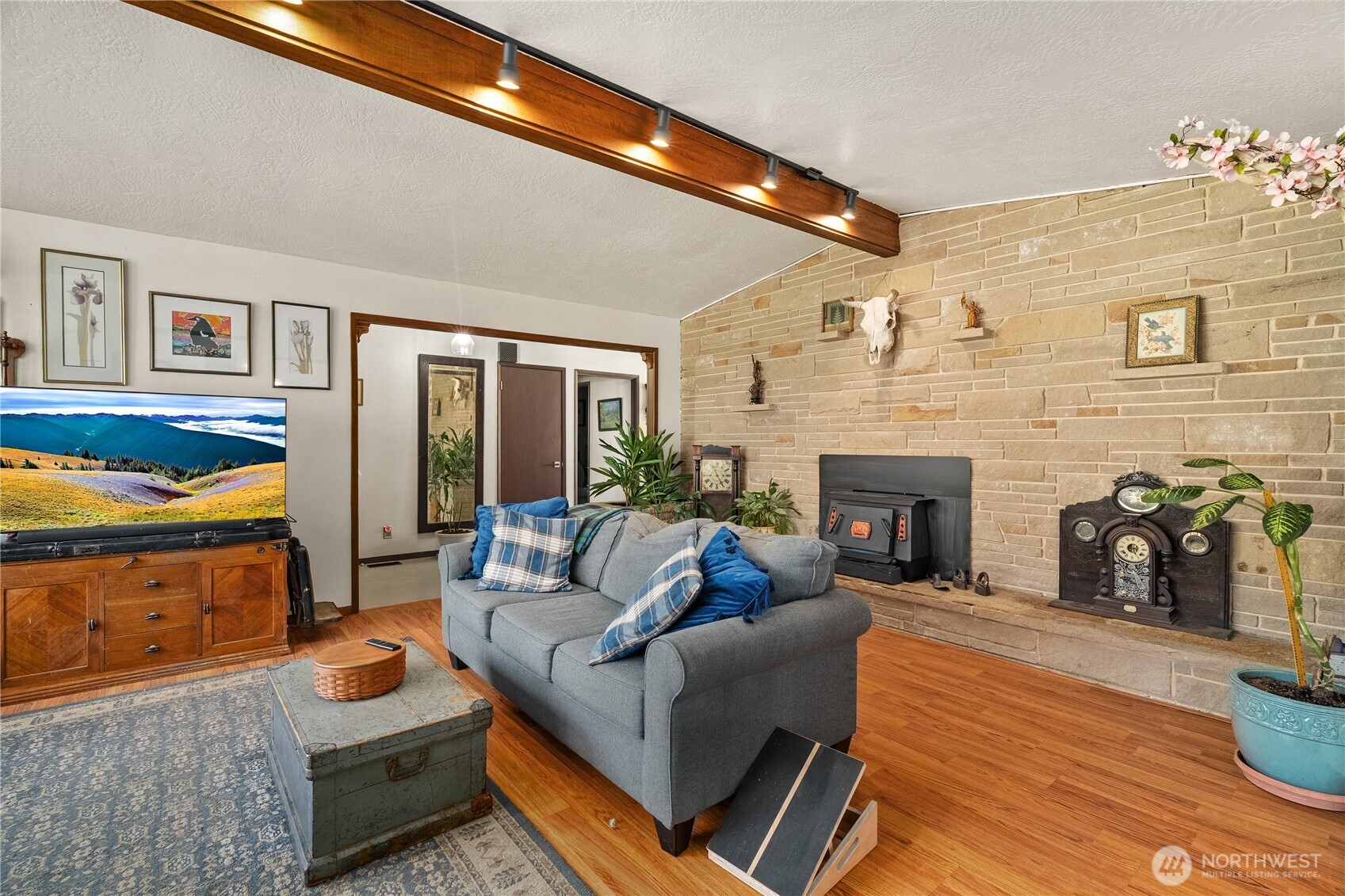 631 5th Avenue Forks, WA 98331 - Photo 5 of 40 a living room with furniture and a fireplace