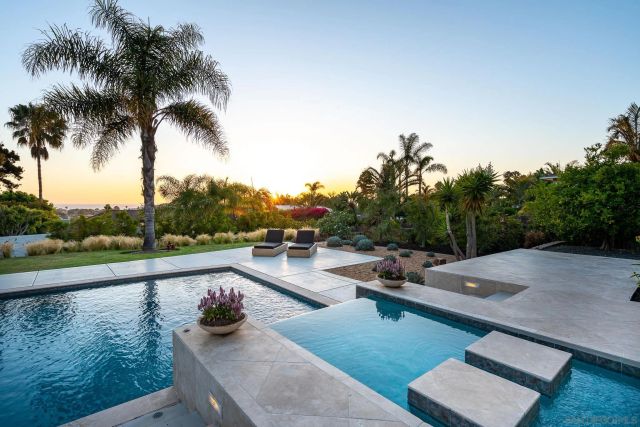 a view of swimming pool with lounge chair