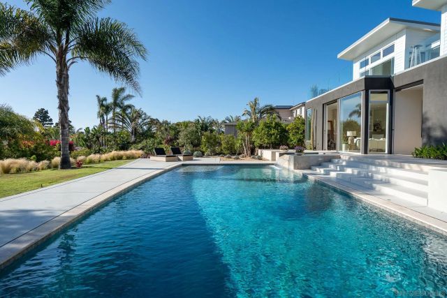 a view of a swimming pool with a patio