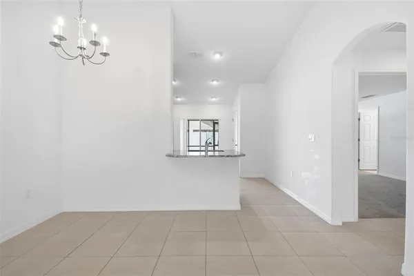 a kitchen with kitchen island a sink appliances and cabinets