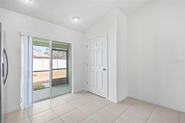 a kitchen with stainless steel appliances granite countertop white cabinets and a stove top oven