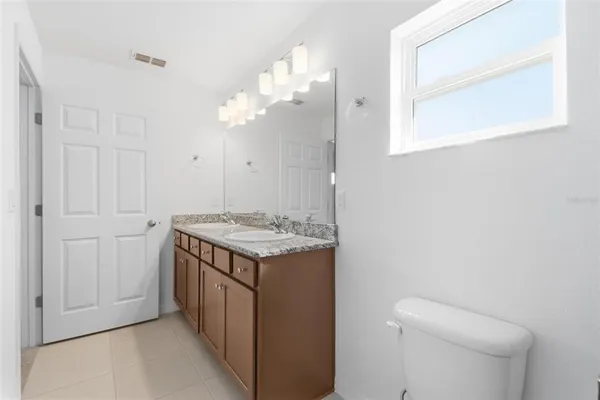 a view of a hallway with wooden shelves