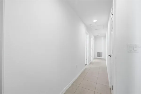 a bathroom with a granite countertop sink a toilet a mirror and shower