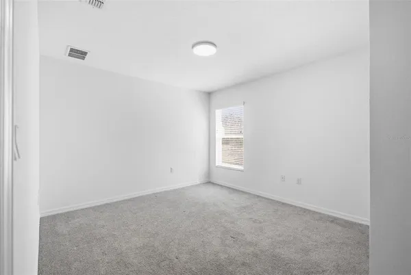 a view of empty room with windows