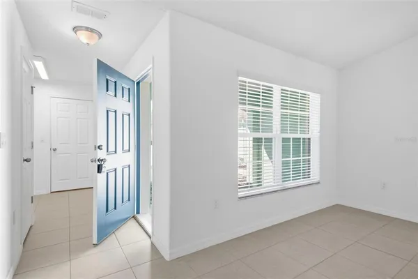 a view of a kitchen with a sink and chandelier