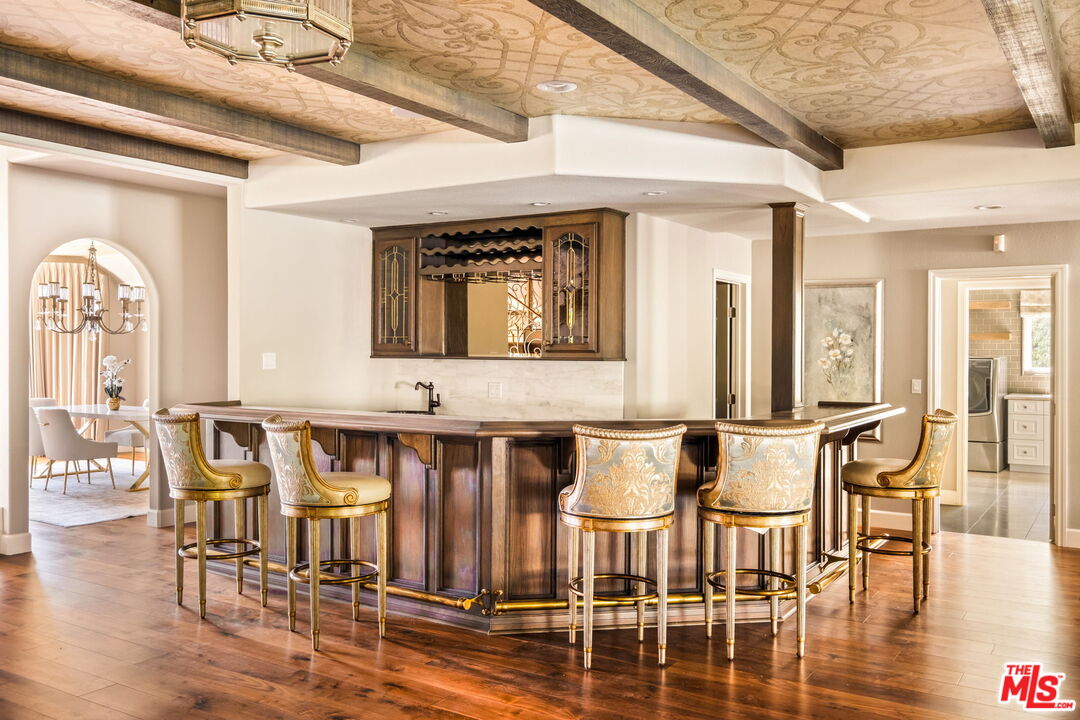 1047 East Pomello Drive Claremont, CA 91711 - Photo 15 of 73 a view of a dining room with furniture and wooden floor