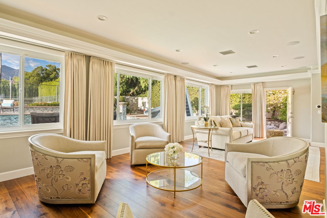 1047 East Pomello Drive Claremont, CA 91711 - Photo 22 of 73 a living room with furniture and a large window