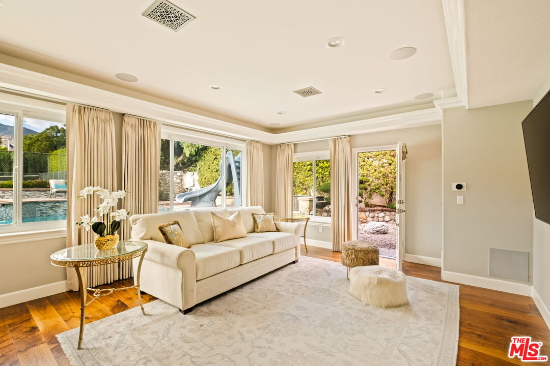 1047 East Pomello Drive Claremont, CA 91711 - Photo 23 of 73 a living room with furniture and a large window