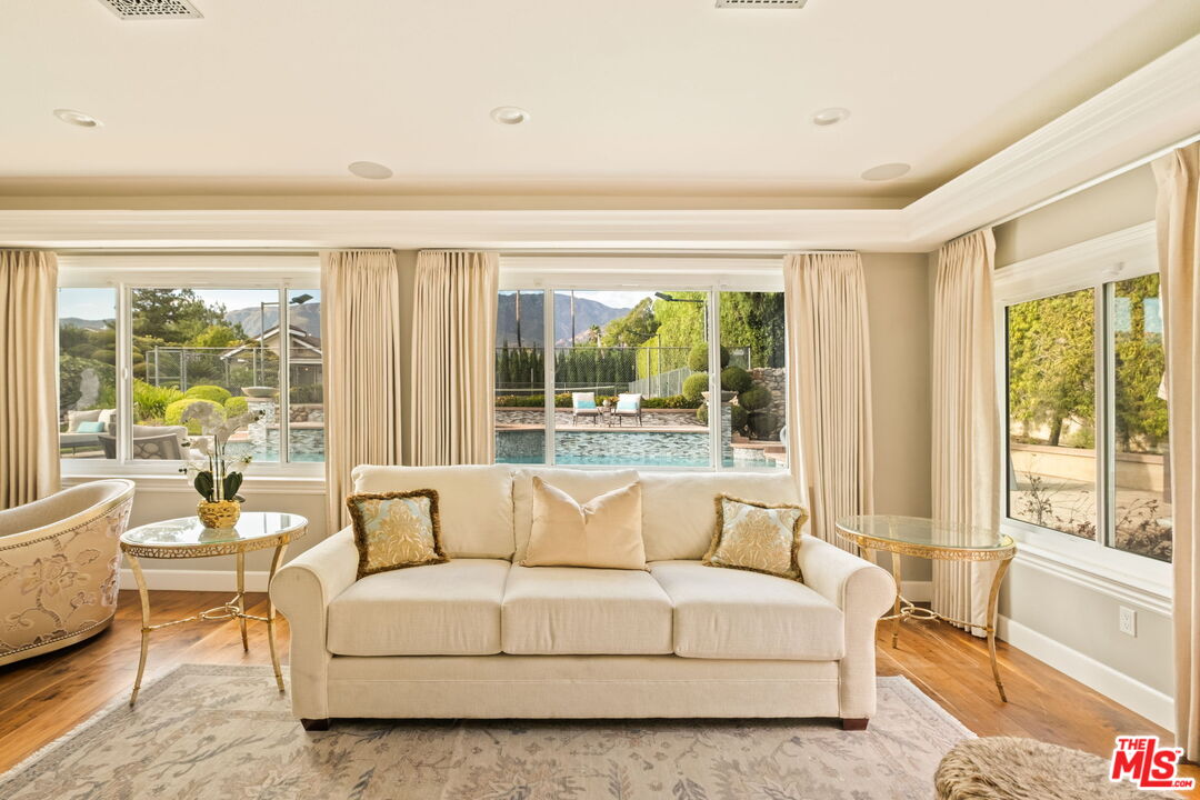 1047 East Pomello Drive Claremont, CA 91711 - Photo 24 of 73 a living room with furniture and a large window