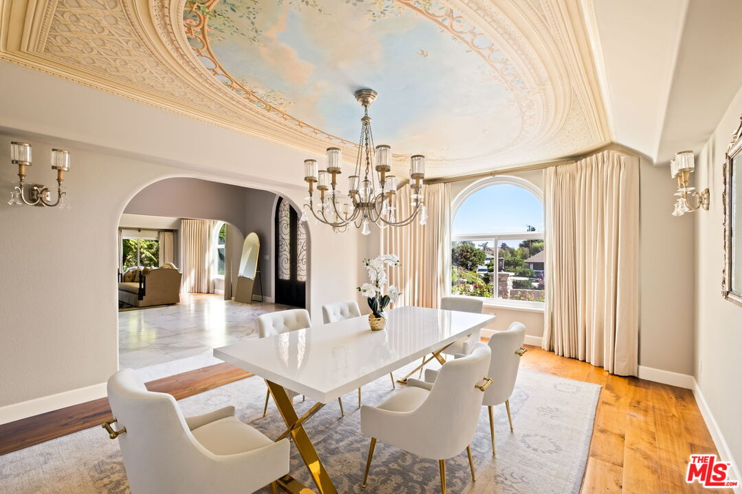 1047 East Pomello Drive Claremont, CA 91711 - Photo 27 of 73 a view of a dining room with furniture a chandelier and wooden floor
