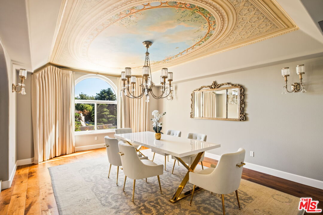 1047 East Pomello Drive Claremont, CA 91711 - Photo 28 of 73 a dining room with furniture a chandelier and wooden floor