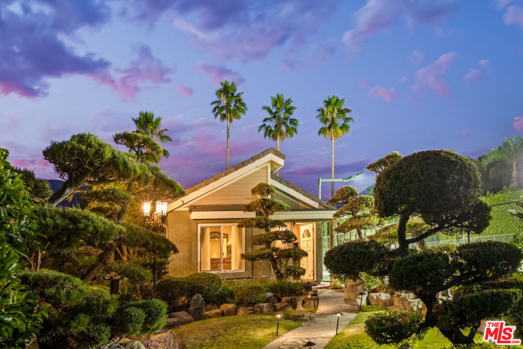 1047 East Pomello Drive Claremont, CA 91711 - Photo 4 of 73 a front view of a house with a yard and potted plants