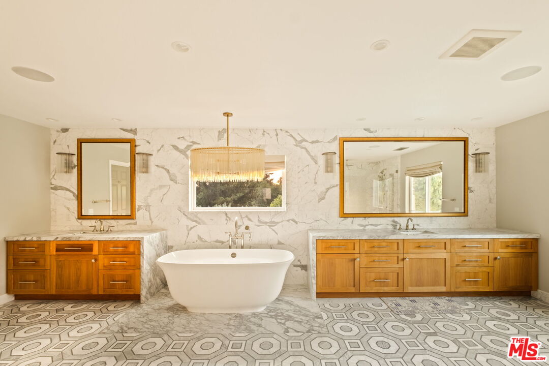 1047 East Pomello Drive Claremont, CA 91711 - Photo 48 of 73 a spacious bathroom with a bathtub and next to a window