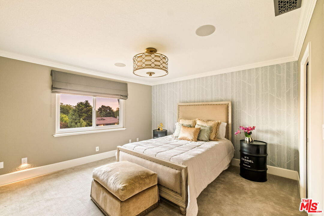 1047 East Pomello Drive Claremont, CA 91711 - Photo 54 of 73 a bedroom with a bed and a painting on the wall