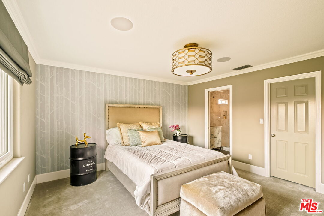 1047 East Pomello Drive Claremont, CA 91711 - Photo 55 of 73 a bedroom with a bed and a chandelier