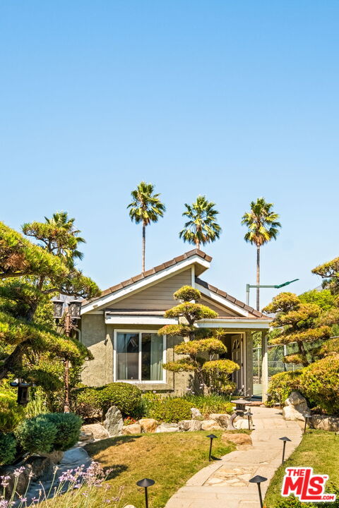 1047 East Pomello Drive Claremont, CA 91711 - Photo 59 of 73 a front view of a house with a yard and fountain