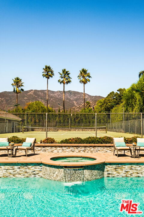 1047 East Pomello Drive Claremont, CA 91711 - Photo 65 of 73 a view of a swimming pool with a table and chairs