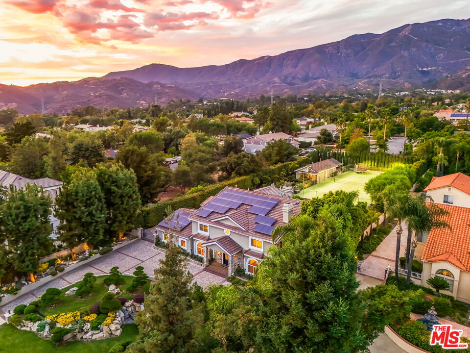 1047 East Pomello Drive Claremont, CA 91711 - Photo 7 of 73 a view of a lush green hillside and a houses