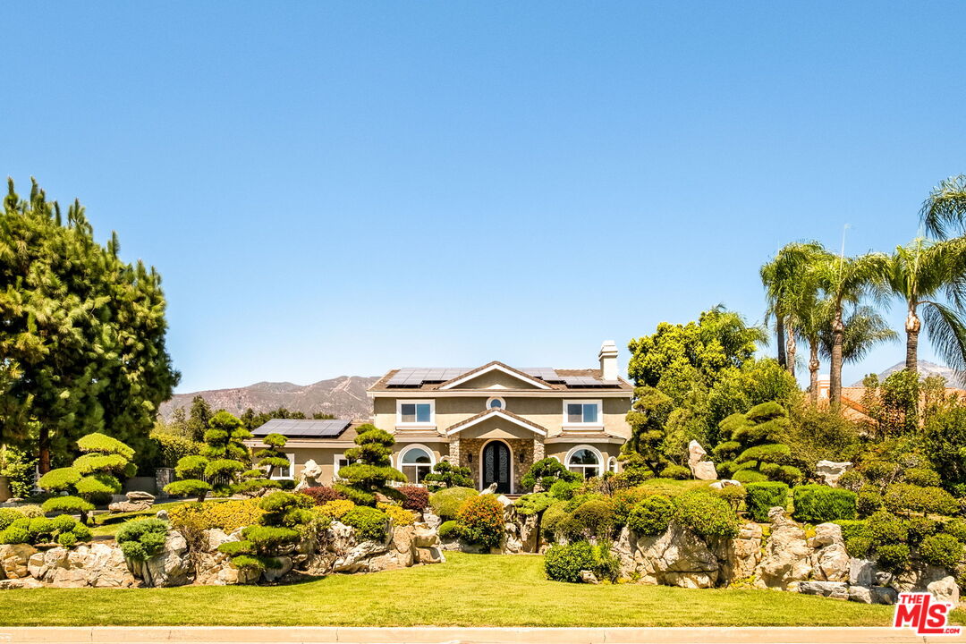 1047 East Pomello Drive Claremont, CA 91711 - Photo 8 of 73 a front view of a house with a yard