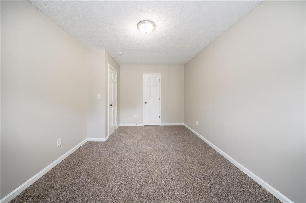 2183 Ramblewood Circle Decatur, GA 30035 - Photo 16 of 37 an empty room with a empty space and windows