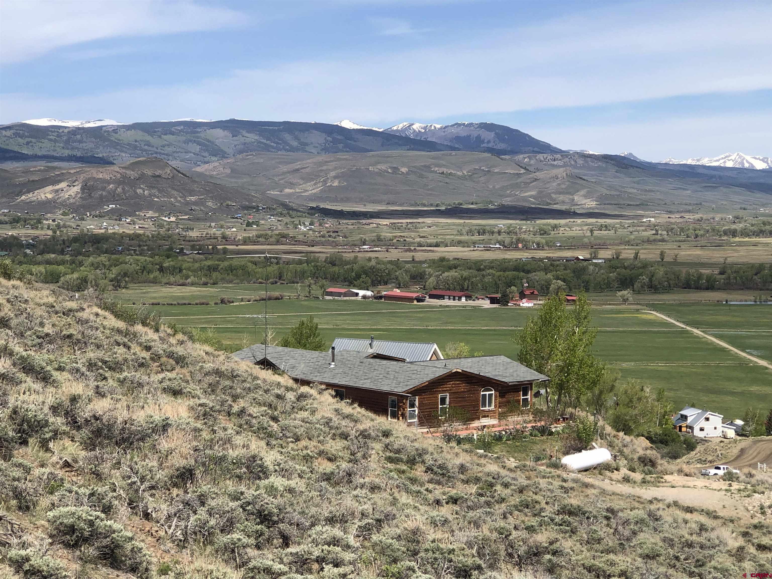 405 Sequoia Drive Gunnison, CO 81230 - Photo 13 of 26 a view of a lake with a mountain in the background