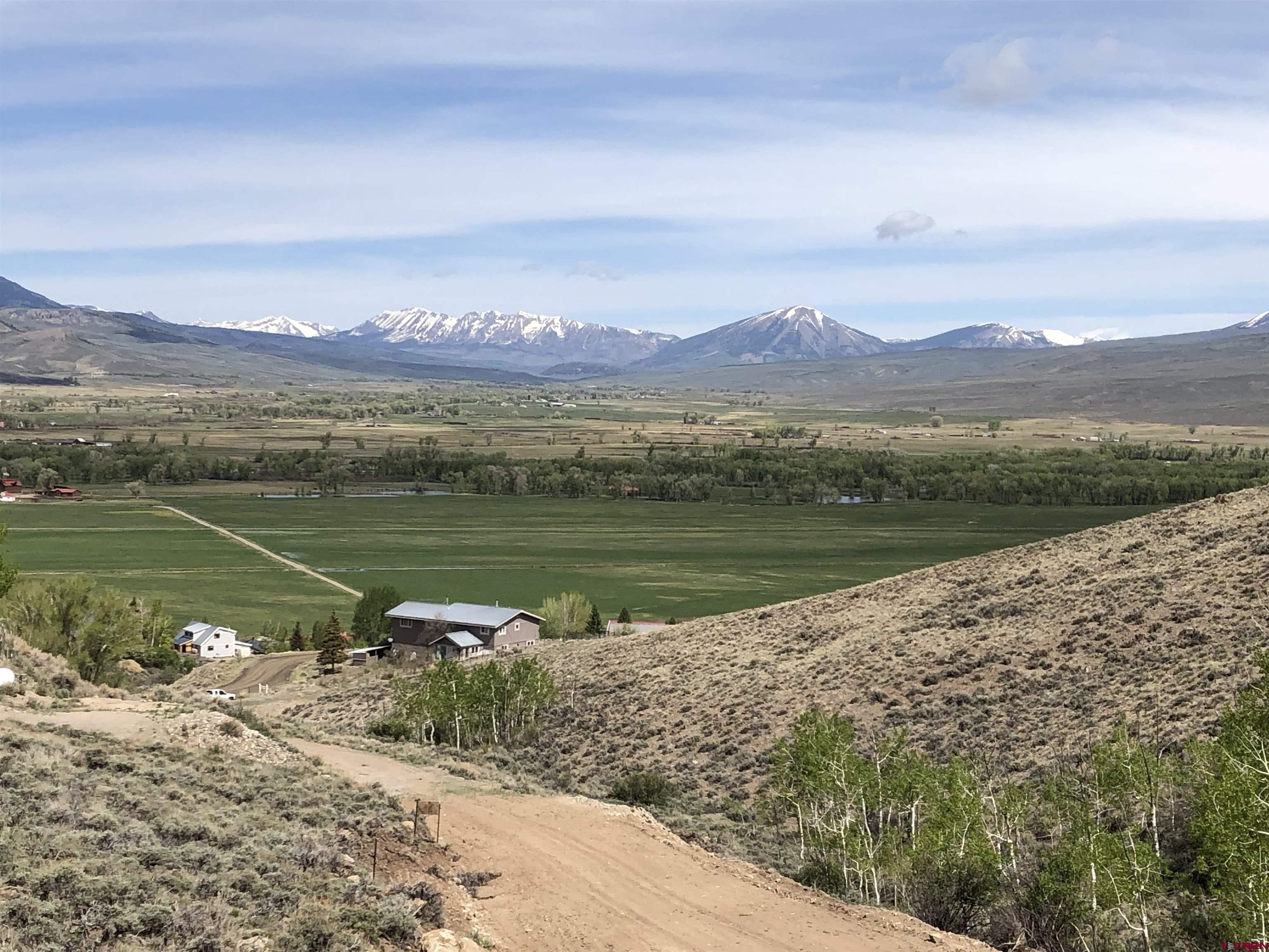 405 Sequoia Drive Gunnison, CO 81230 - Photo 5 of 26 a view of a lake with a city
