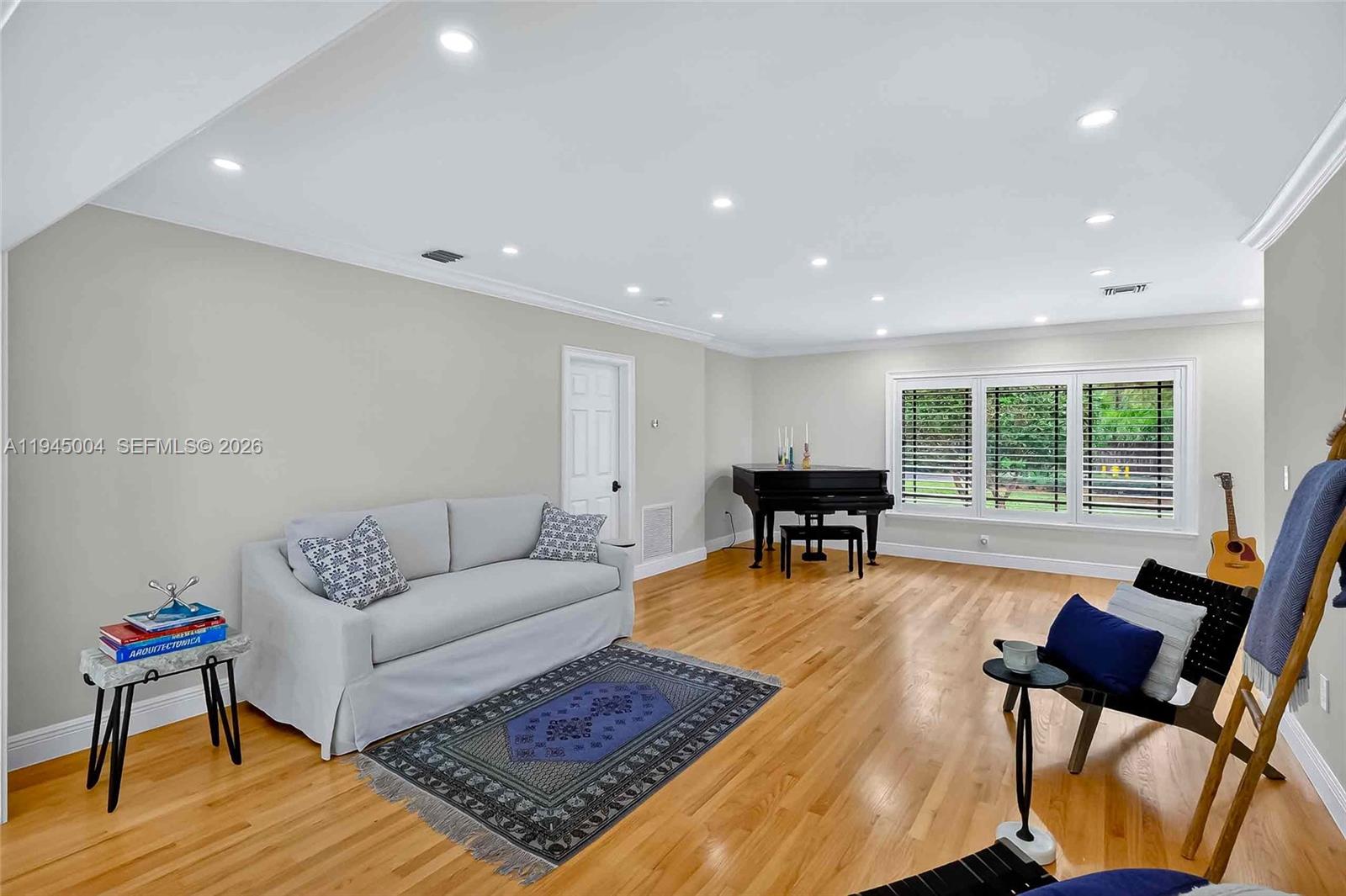 13945 North Cartee Road Palmetto Bay, FL 33158 - Photo 12 of 29 a living room with furniture and a window