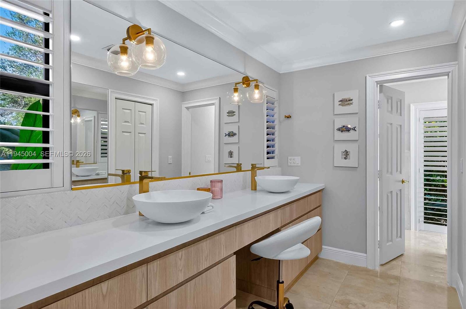 13945 North Cartee Road Palmetto Bay, FL 33158 - Photo 17 of 29 a bathroom with a granite countertop sink and a mirror