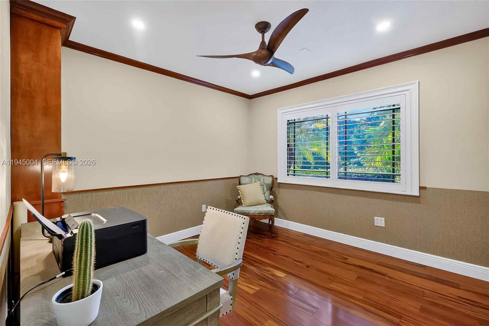 13945 North Cartee Road Palmetto Bay, FL 33158 - Photo 23 of 29 a workspace with furniture wooden floor and a ceiling fan