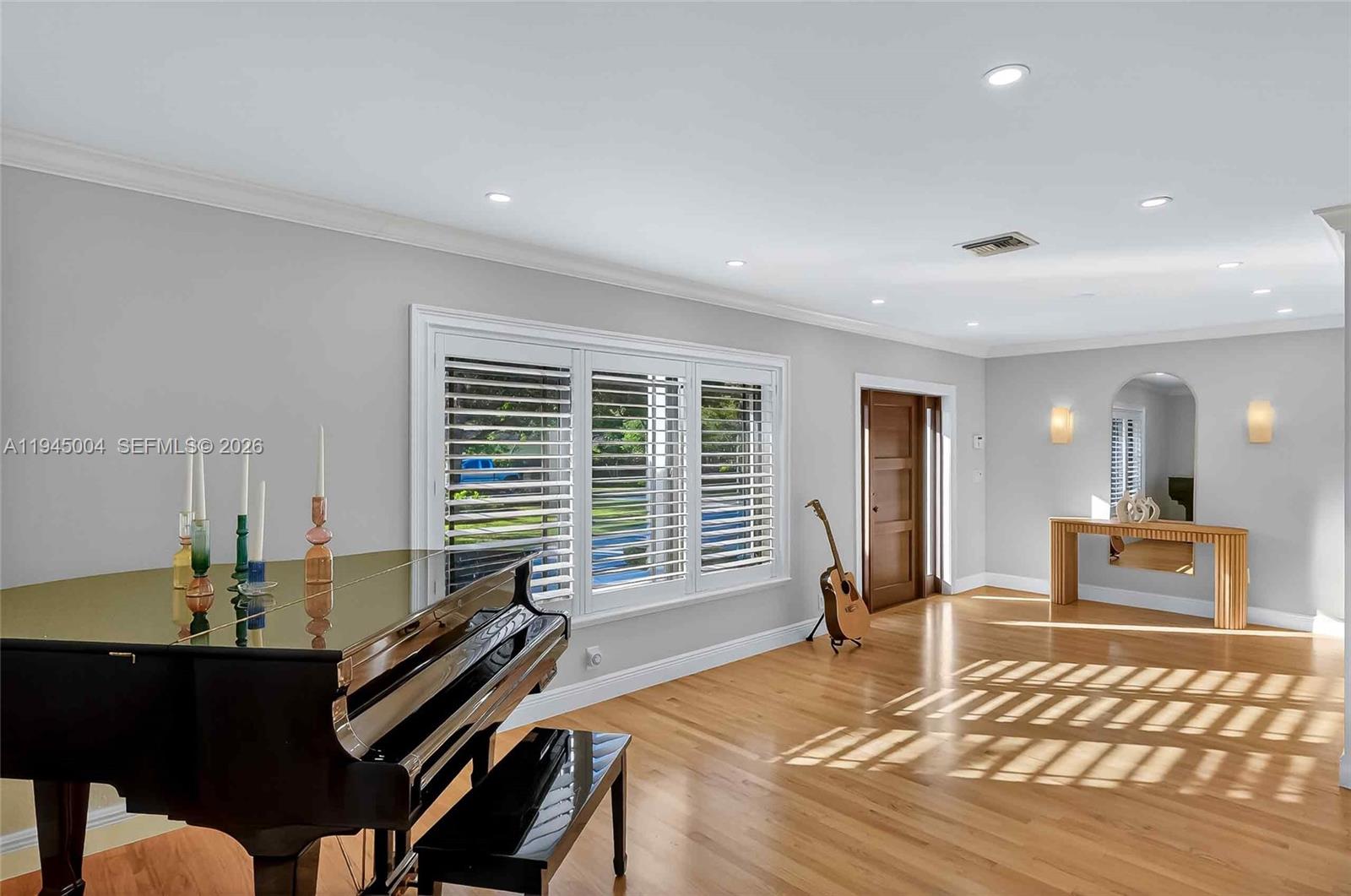 13945 North Cartee Road Palmetto Bay, FL 33158 - Photo 26 of 29 a living room with furniture a wooden floor and a table