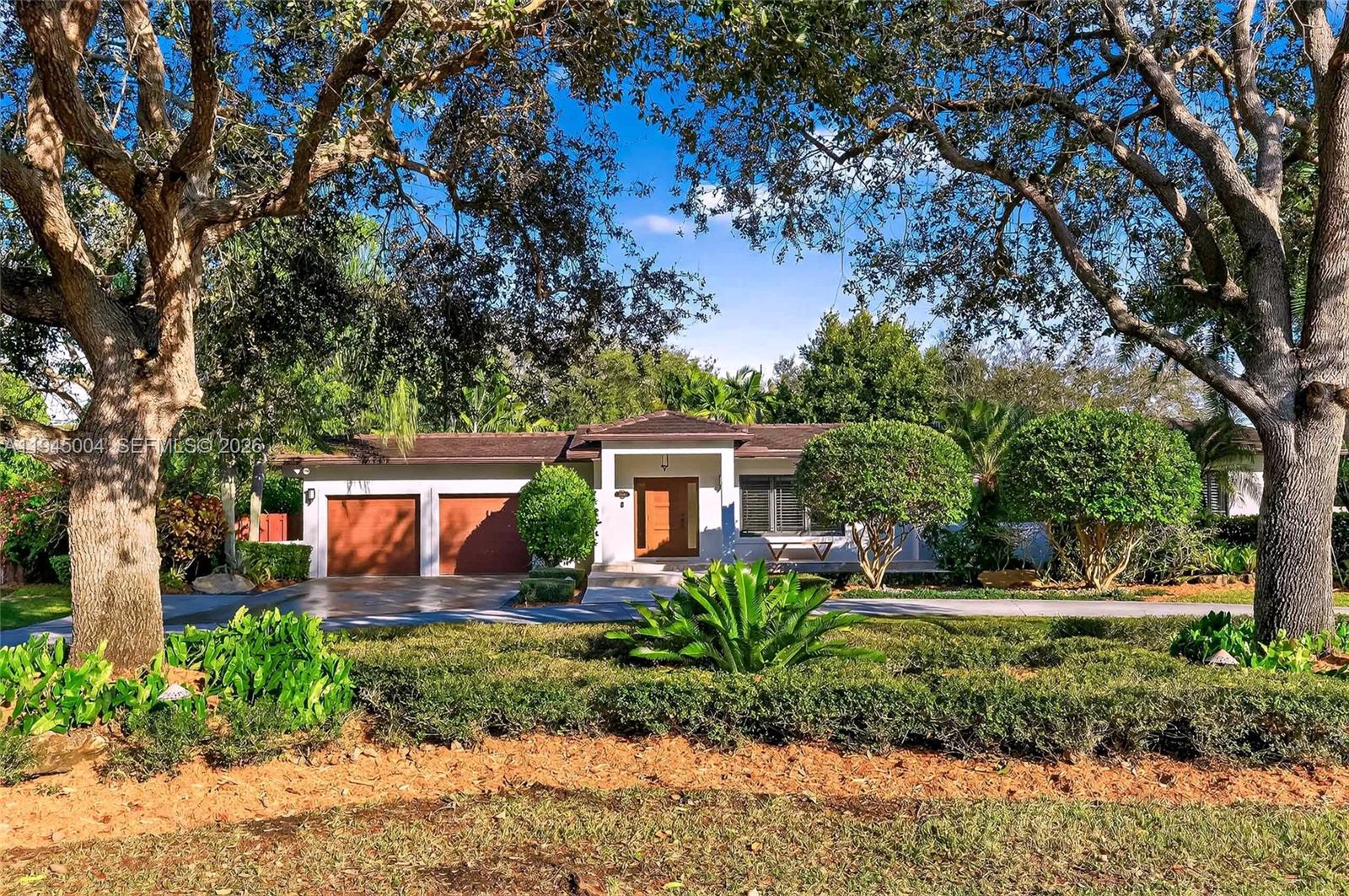 13945 North Cartee Road Palmetto Bay, FL 33158 - Photo 28 of 29 a front view of a house with garden