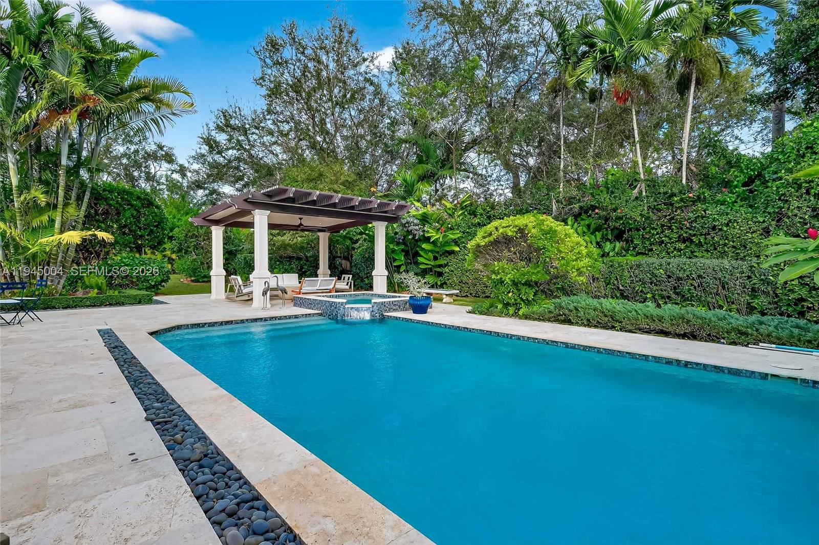 13945 North Cartee Road Palmetto Bay, FL 33158 - Photo 3 of 29 a view of a patio with swimming pool