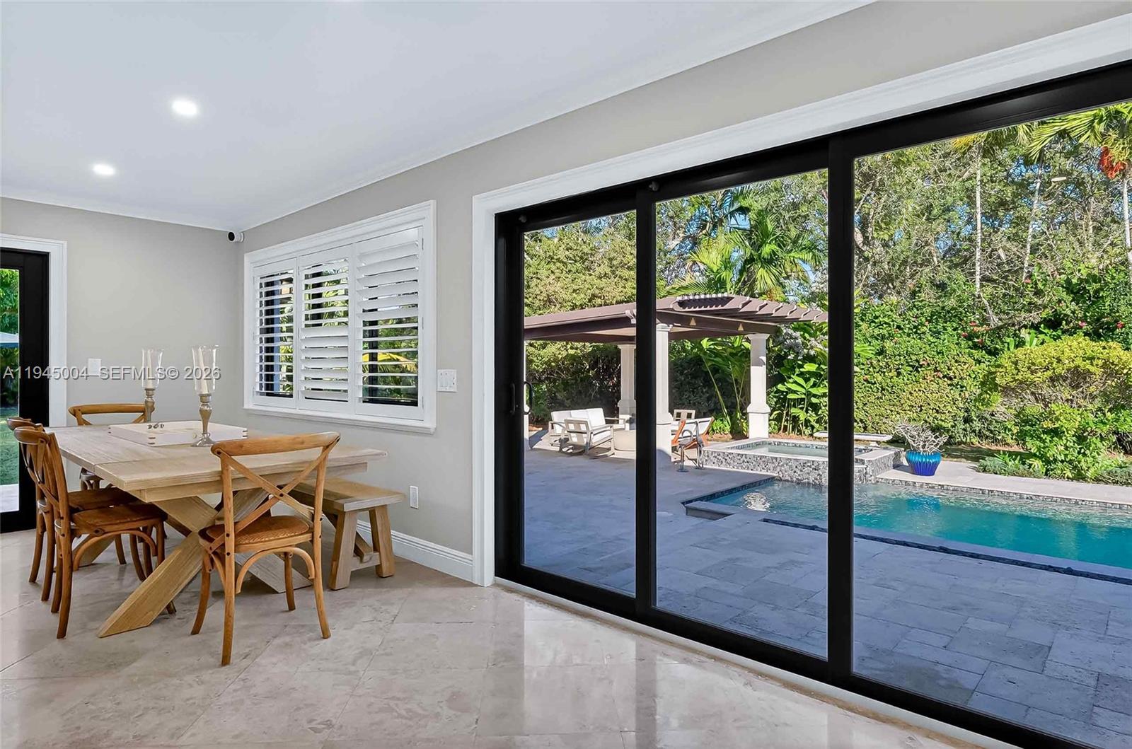 13945 North Cartee Road Palmetto Bay, FL 33158 - Photo 4 of 29 a view of a dining room with furniture window and outside view