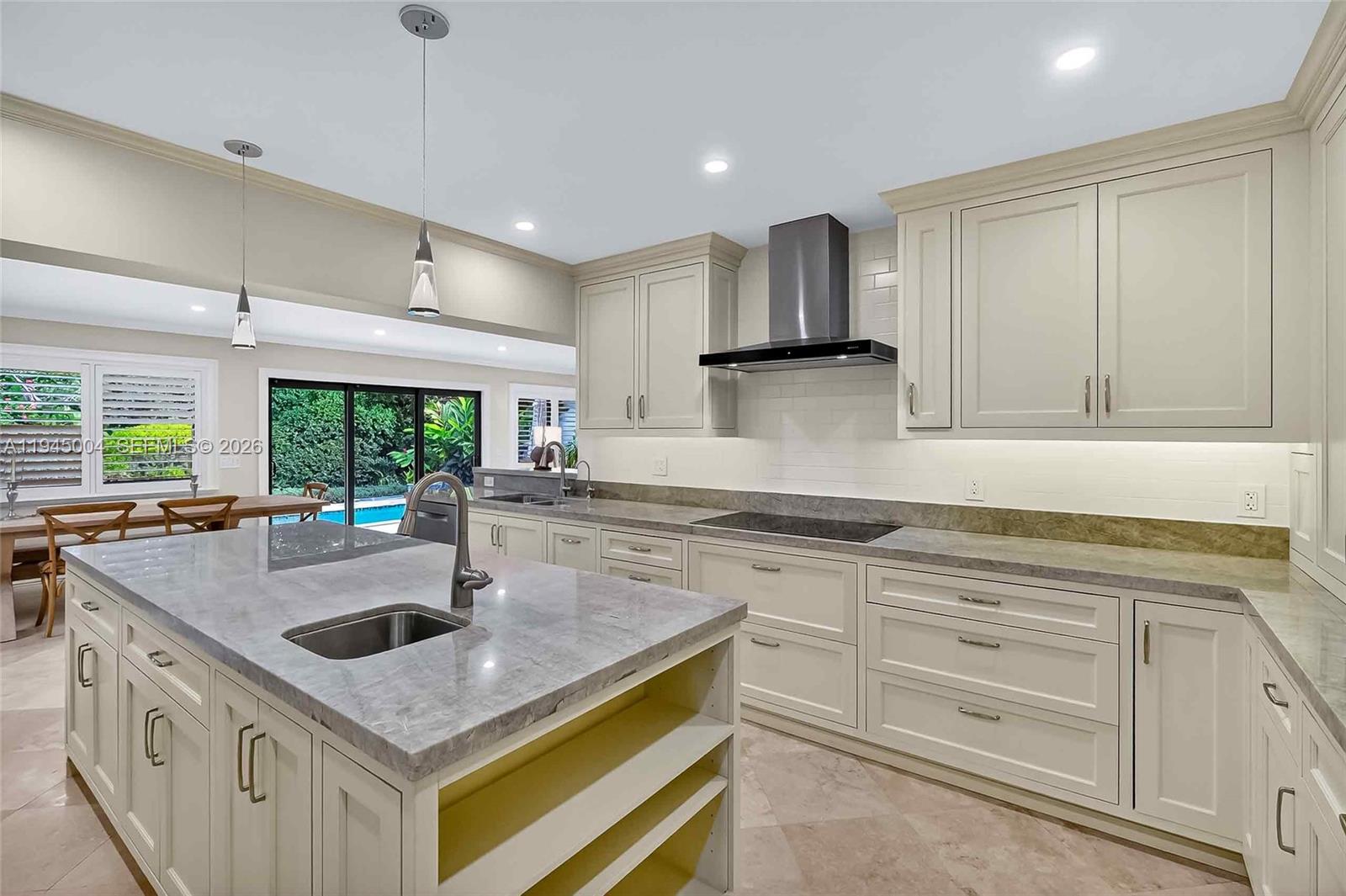 13945 North Cartee Road Palmetto Bay, FL 33158 - Photo 7 of 29 a kitchen with stainless steel appliances granite countertop a sink and a stove
