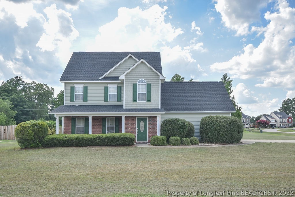 6700 Valley Falls Road Hope Mills, NC 28348 - Photo 1 of 48 a front view of a house with a garden