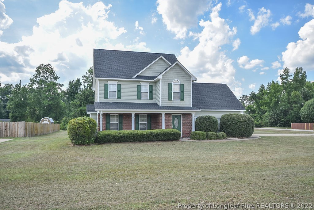 6700 Valley Falls Road Hope Mills, NC 28348 - Photo 2 of 48 a front view of a house with a yard