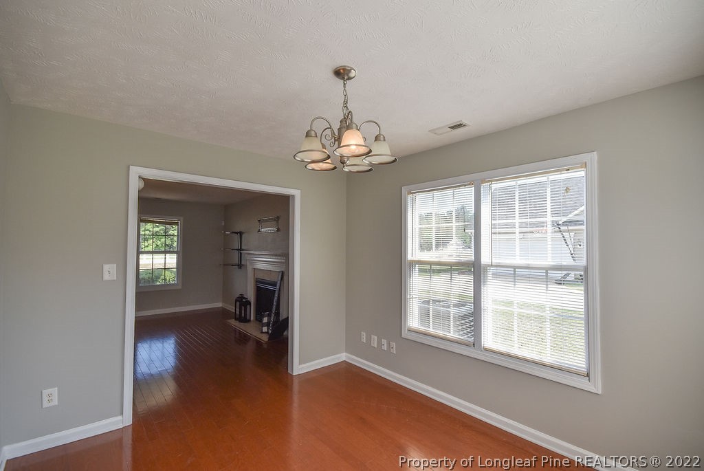 6700 Valley Falls Road Hope Mills, NC 28348 - Photo 21 of 48 wooden floor in an empty room with a window