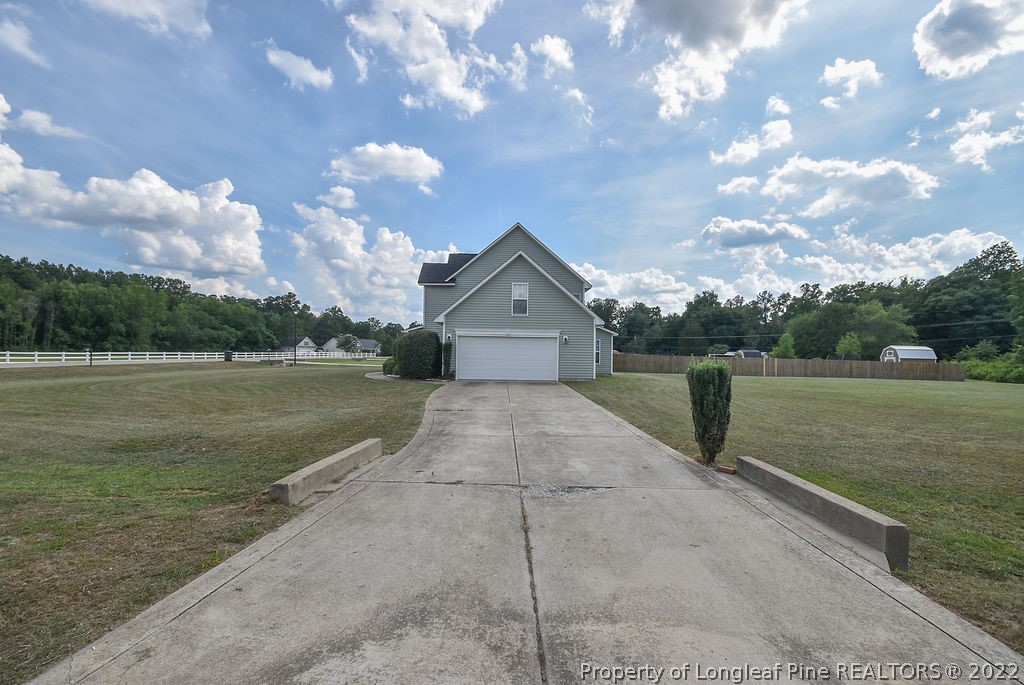 6700 Valley Falls Road Hope Mills, NC 28348 - Photo 38 of 48 a view of a house with a yard